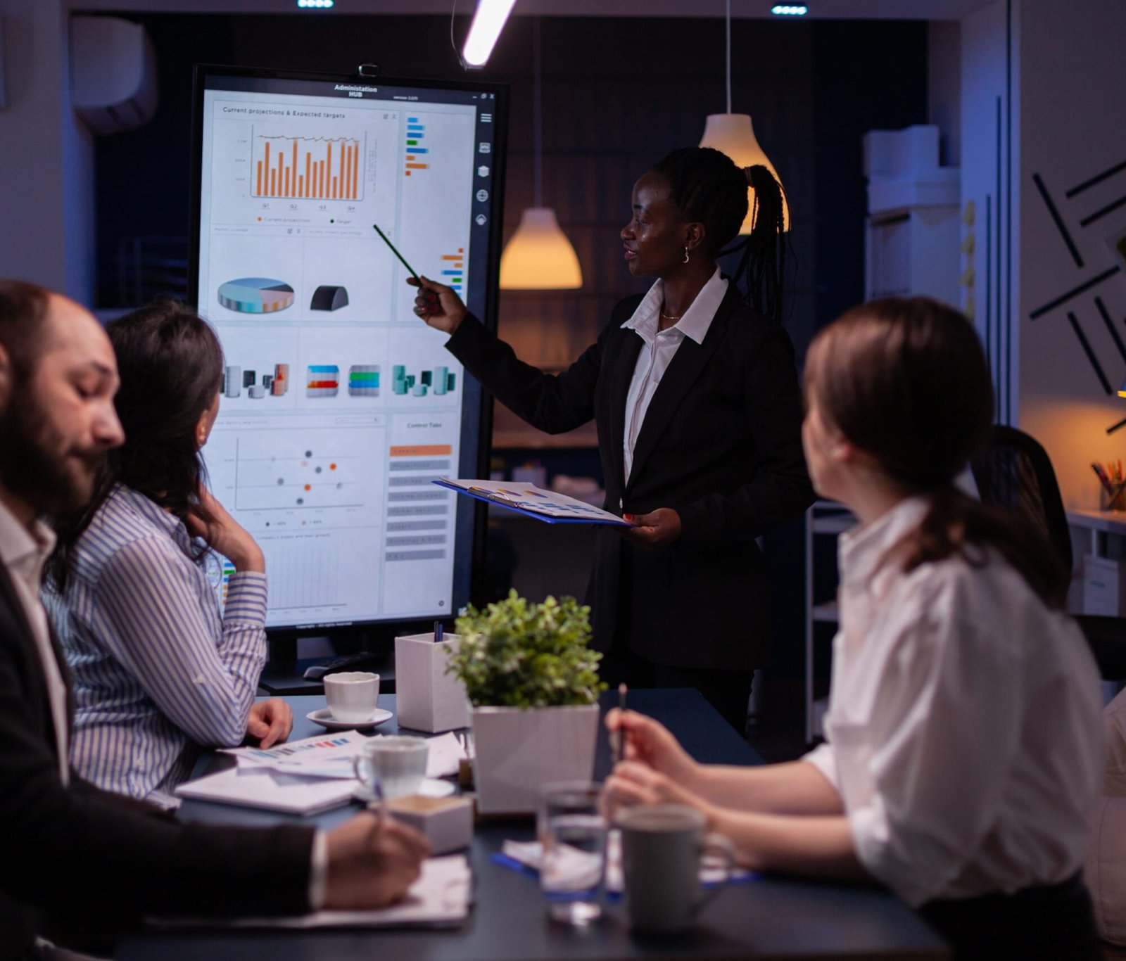 workaholic-african-american-leader-standing-front-presentation-monitor-explaining-marketing-pr (1)